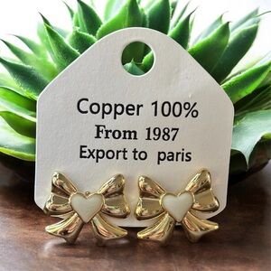 Gold bow stud earrings 18k over copper. .925 posts.